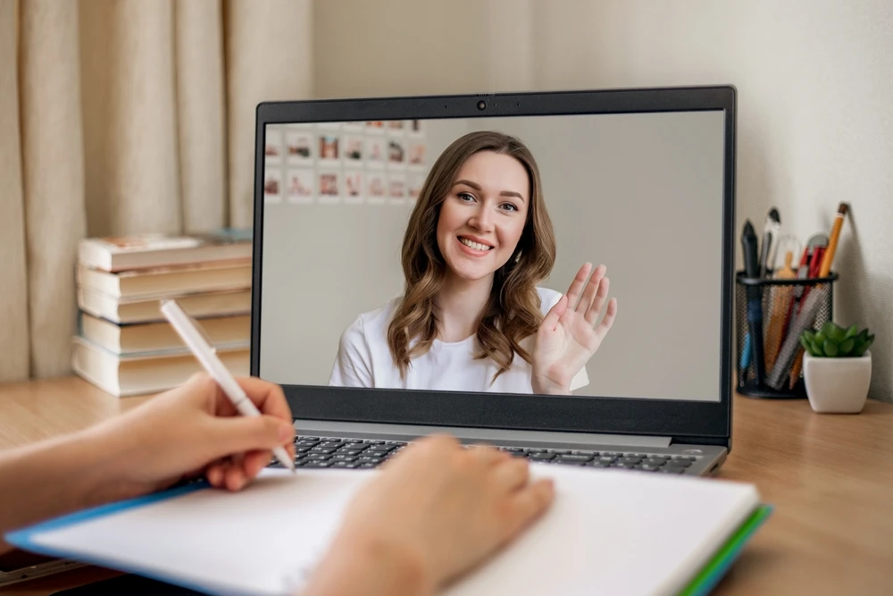 Woman completing hormone & health assessment online with provider